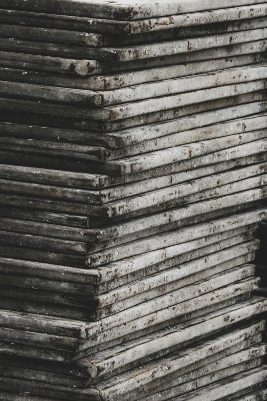 several old corrugated roof sections stacked together