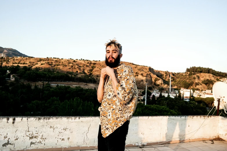 a man is posing for the camera with a very short beard