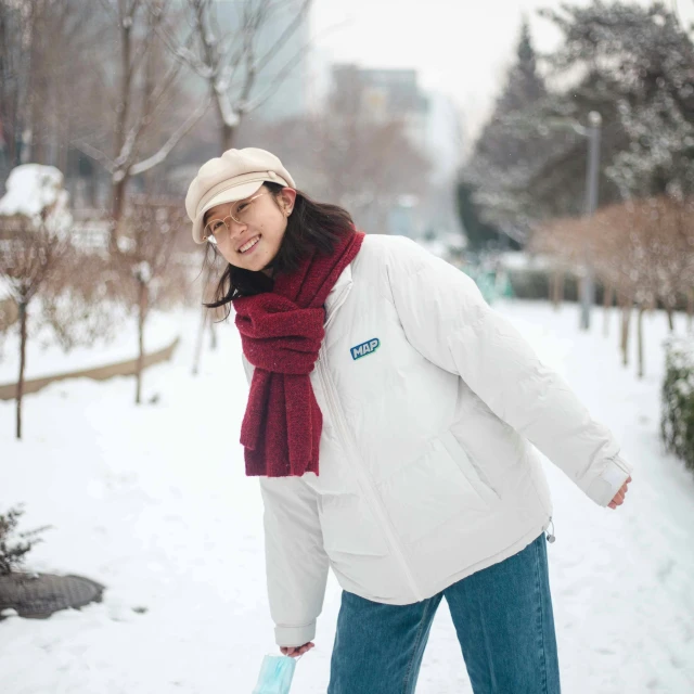 a lady that is walking on the snow