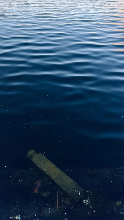 blue water is reflected from the surface with light coming through