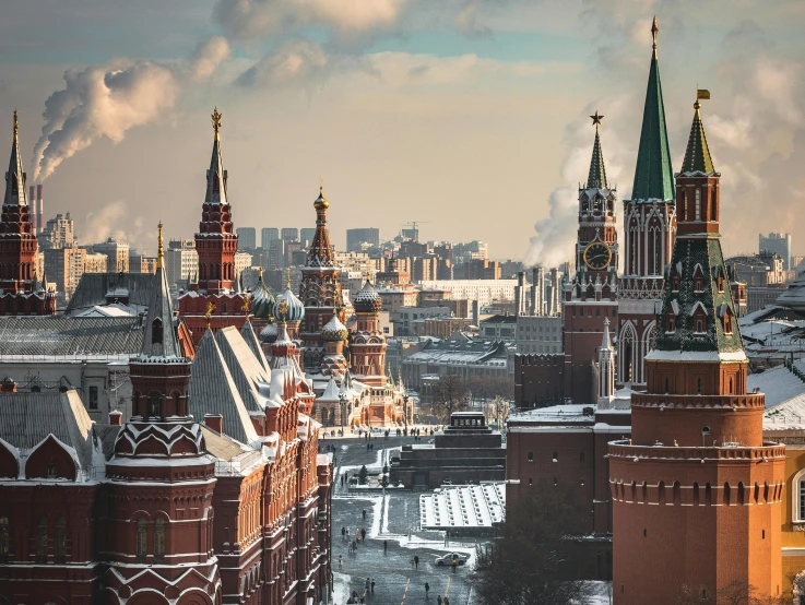 several buildings are shown in the distance with tall towers