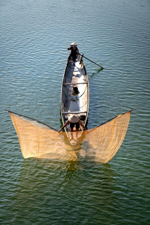 a person riding in a large wooden boat