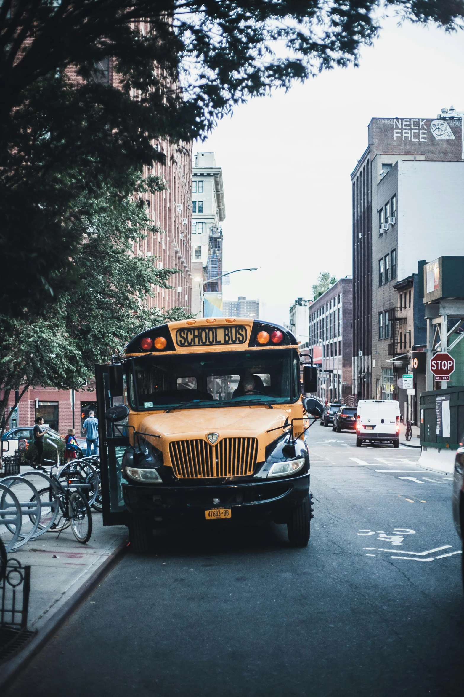 a school bus drives down a city street