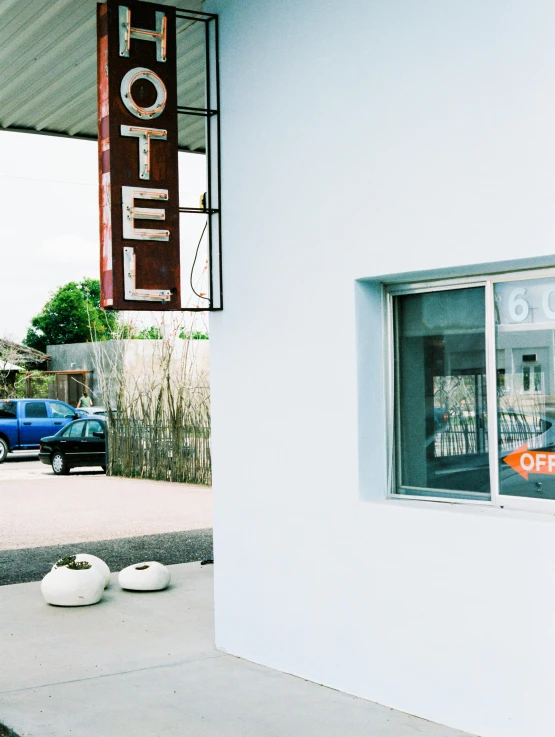 a el sign in the window of a motel