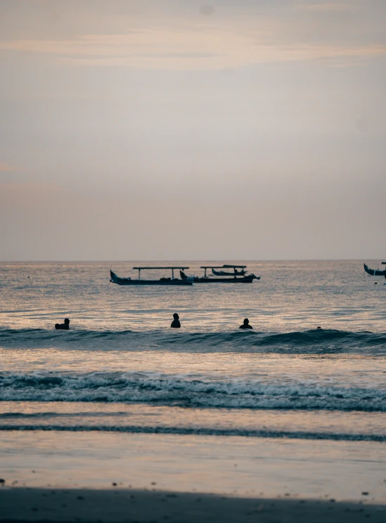 some very pretty people in the water at sunset