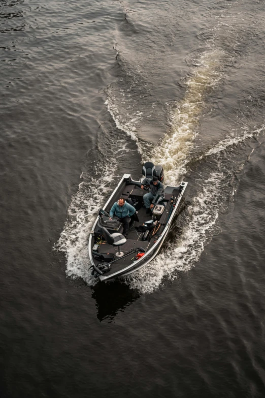 a boat on a body of water with some people