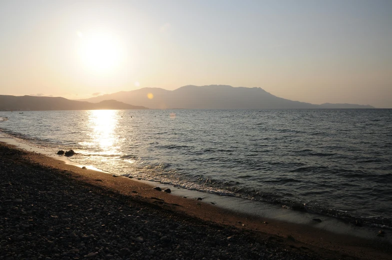 a view of a large body of water from a shore line