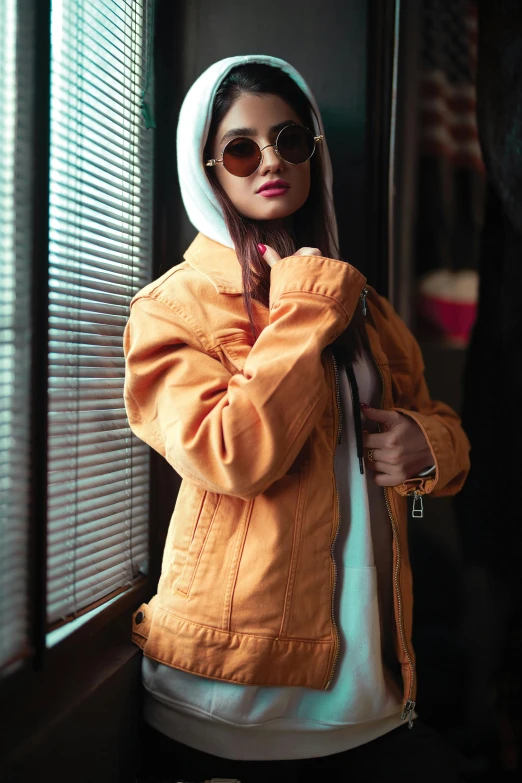 a woman with glasses on posing for a picture