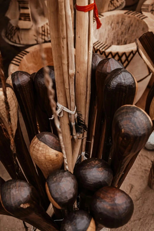 some very large wooden objects with a long stick in the middle