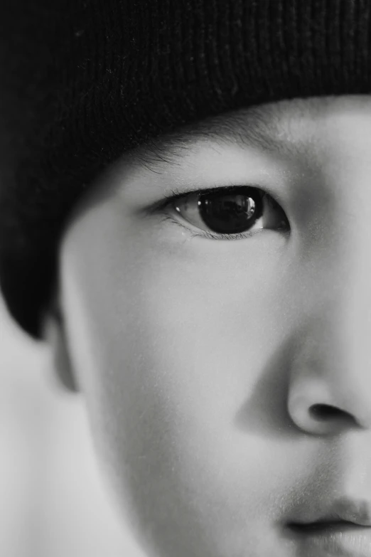 a close up of a person wearing a beanie hat