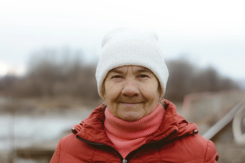 a person wearing a white hat and red jacket