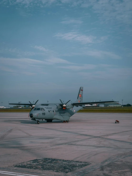 the large military aircraft is parked on the tarmac