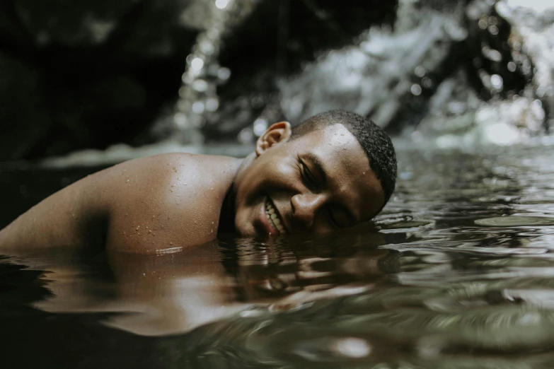 man relaxing in water on sunny day during daytime