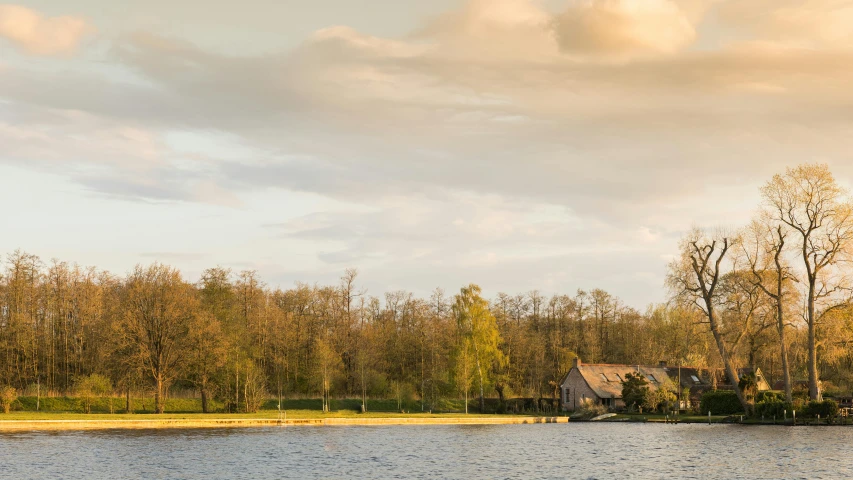 a rural home sitting on a lake