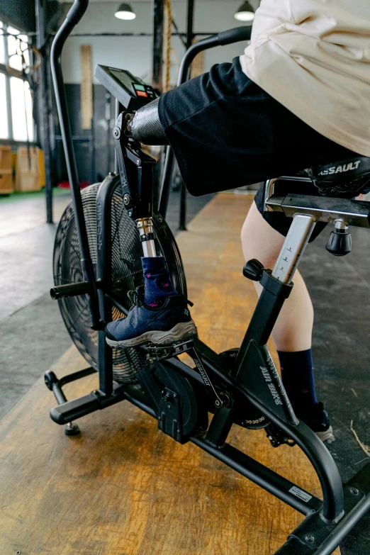 someone rides their bike indoors on an exercise exercise bike