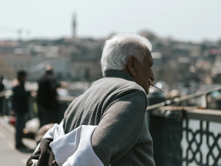 an older man is walking down the street