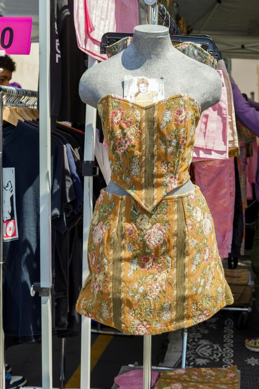 a display case with various clothing on display