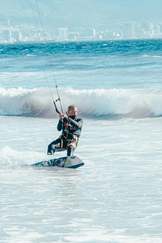 the man is surfing with his skiis in the ocean