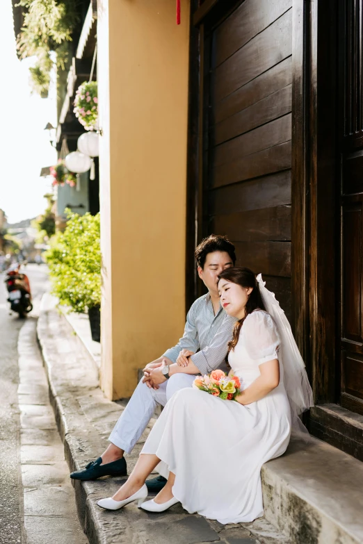 a couple that are sitting on some steps