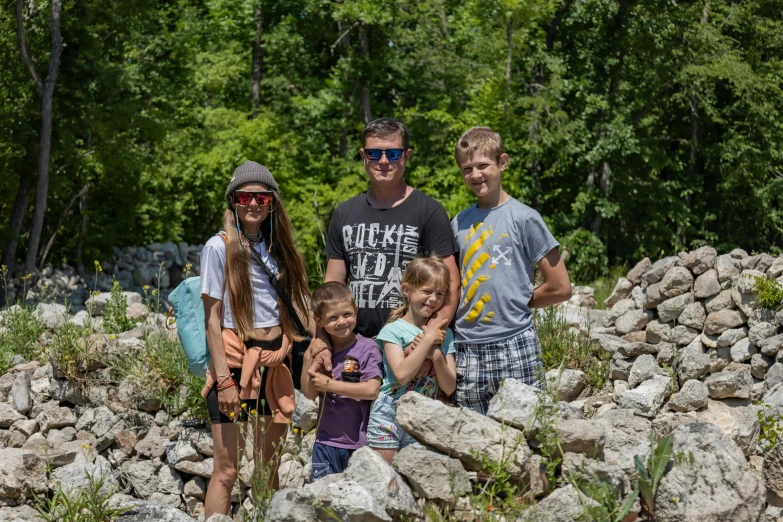 two adults and two children posing for the camera