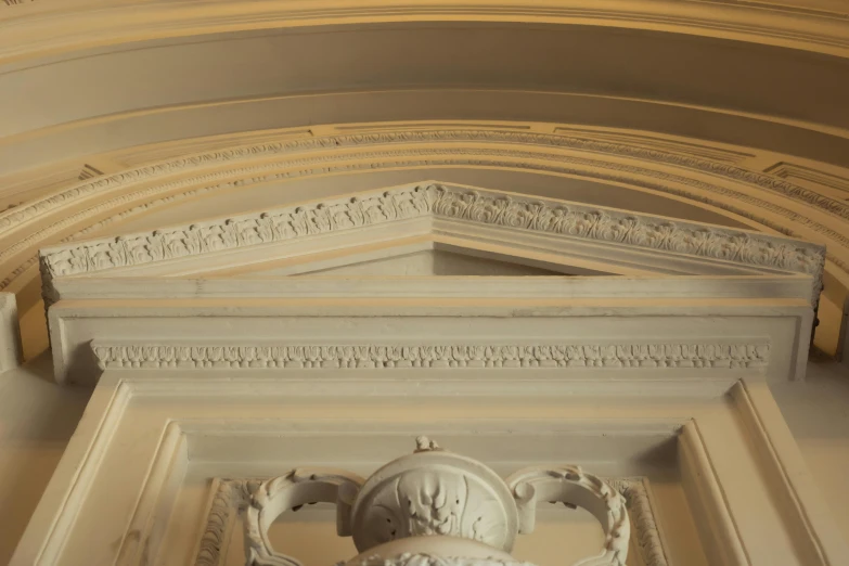 a very elaborate decorative ceiling in an old building