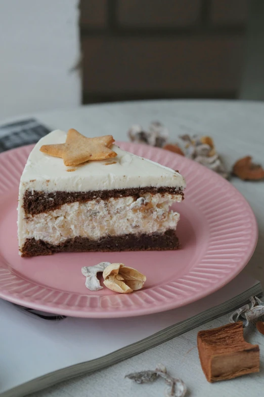 a pink plate topped with a slice of layered cake