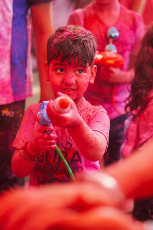 a  is playing with toys as people watch