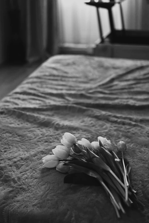 a bunch of flowers sit on the floor by a chair