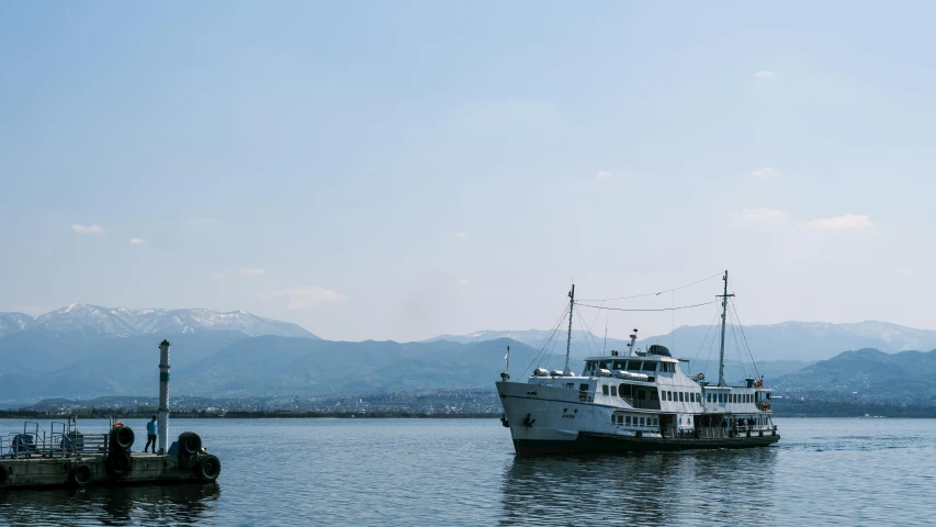 a big ship floating on top of a large body of water