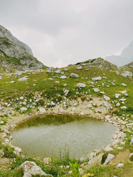 a small lake in a mountain valley