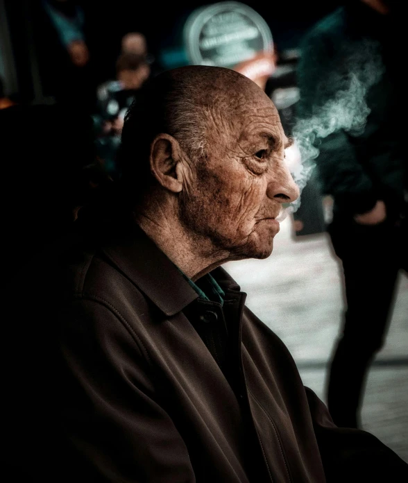 the old man with a cigarette on a street corner