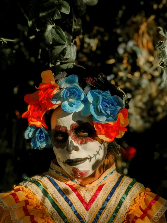 the woman is painted all in colorful makeup