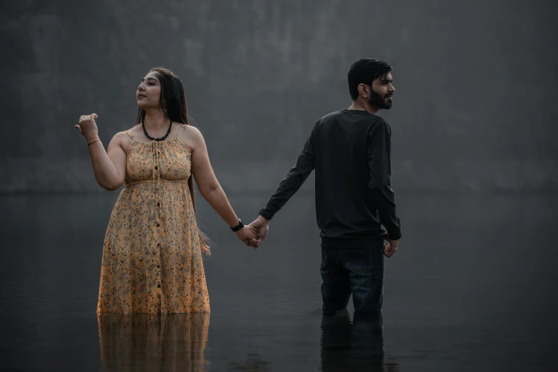 a couple is walking in the rain together