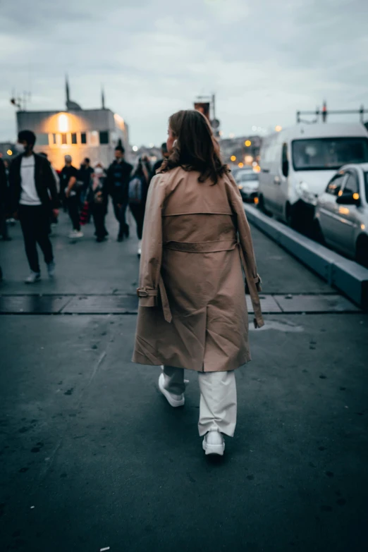 a group of people walking down the street