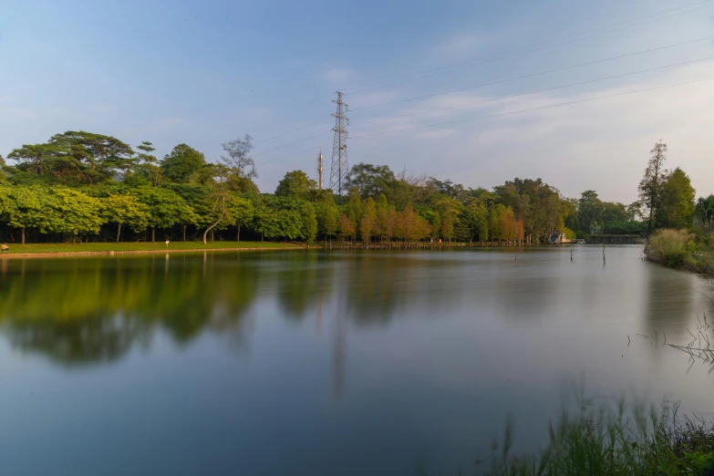 a large river with a bench next to it