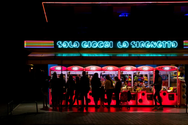 a very bright neon sign above an entrance