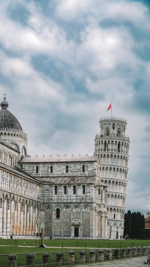 a large stone building has a clock on the top