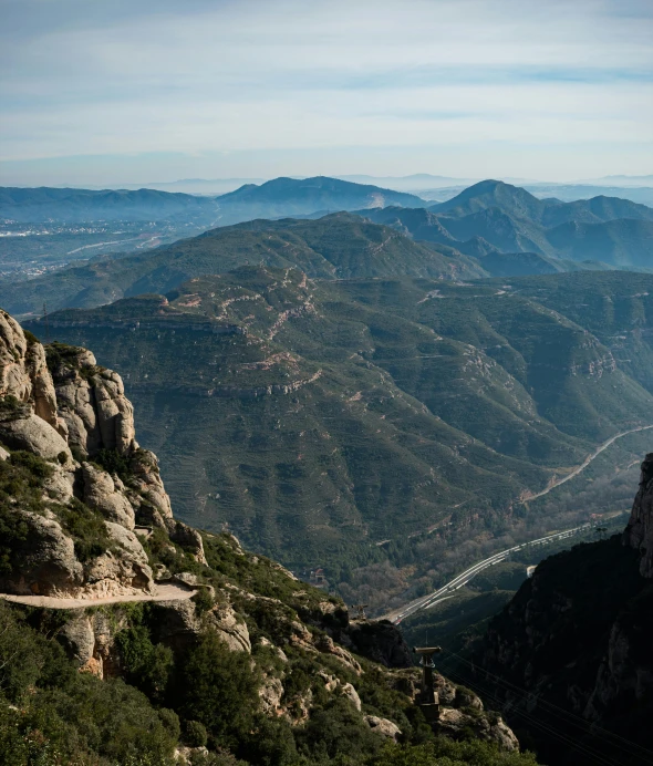 the landscape on the side of a hill with a trail