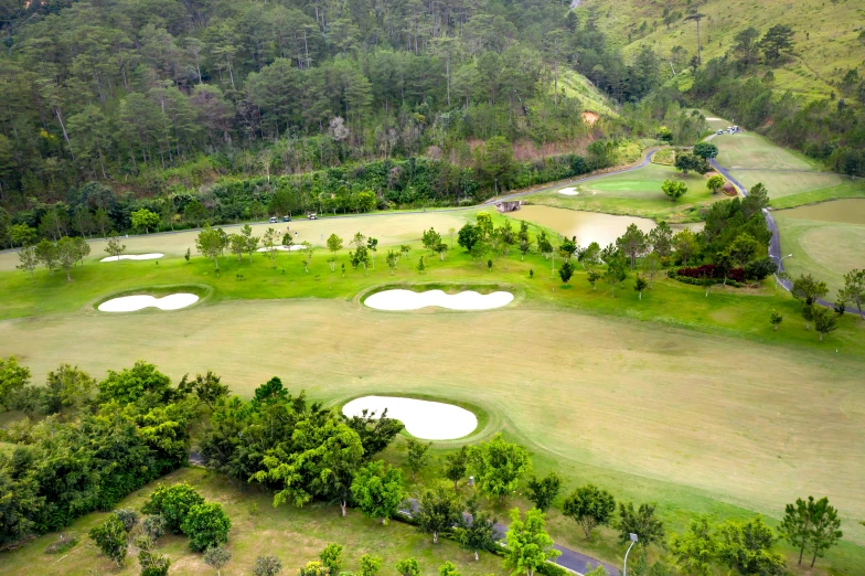 a group of golf greens in the distance