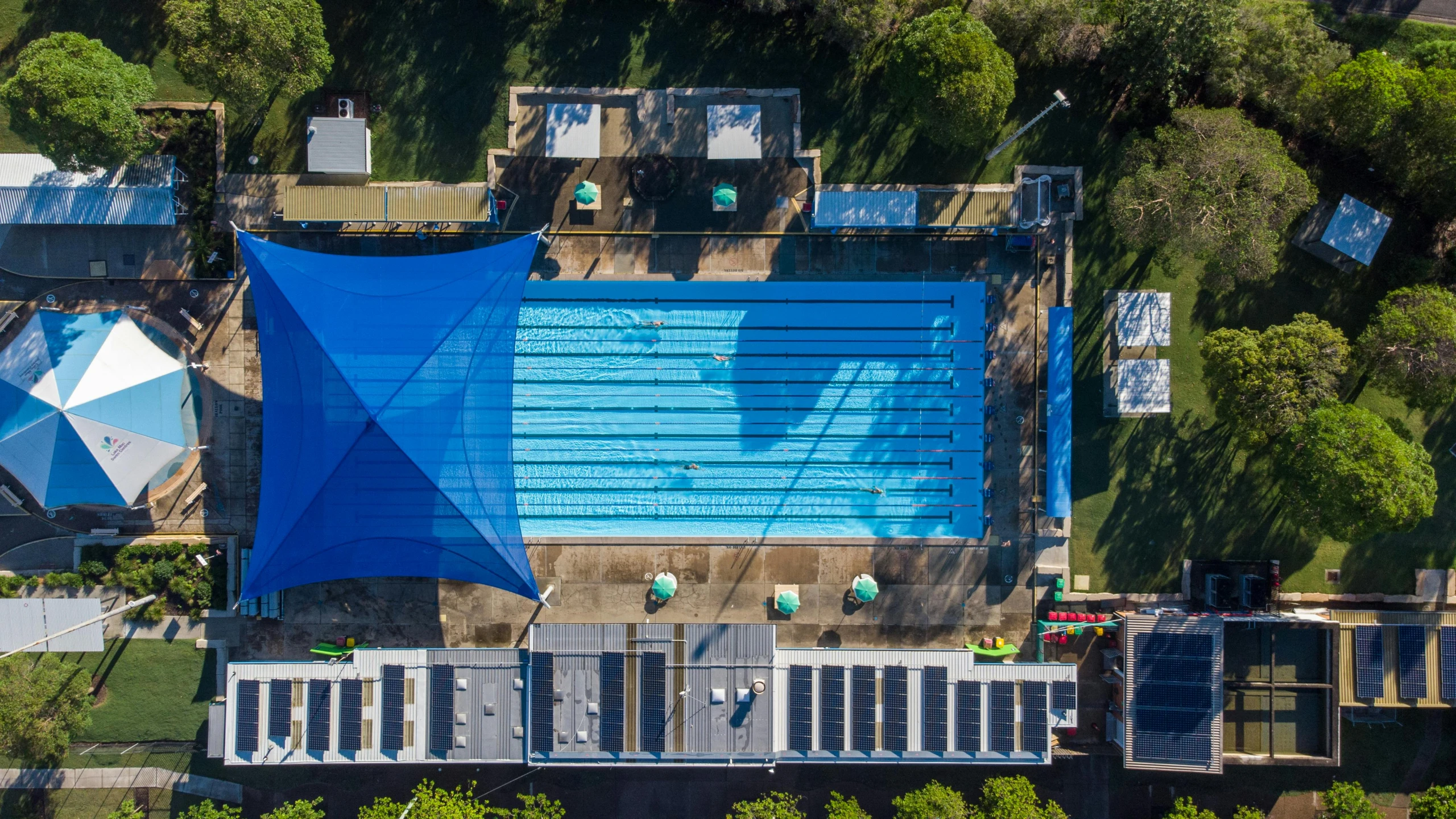 a aerial view of a pool and a swimming deck