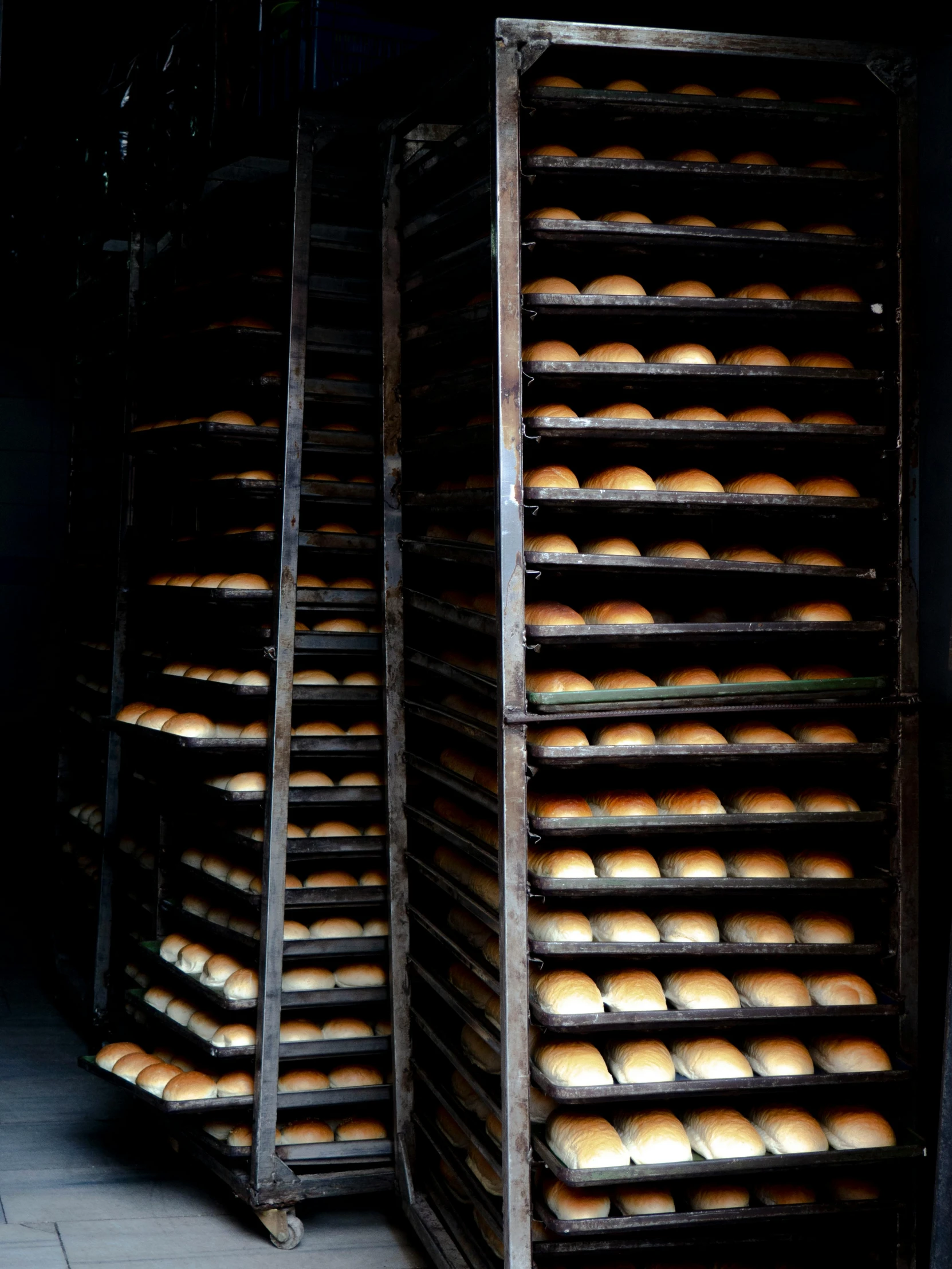 an overloaded batch of bread on a rack