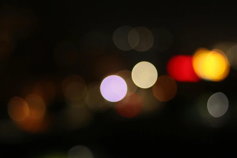 some blurry lights of a dark city at night