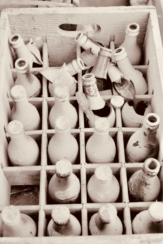 sepia image of an antique box with bottles