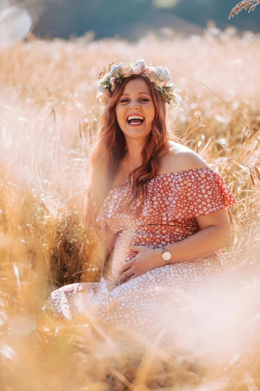 a woman wearing a crown in a field of wheat