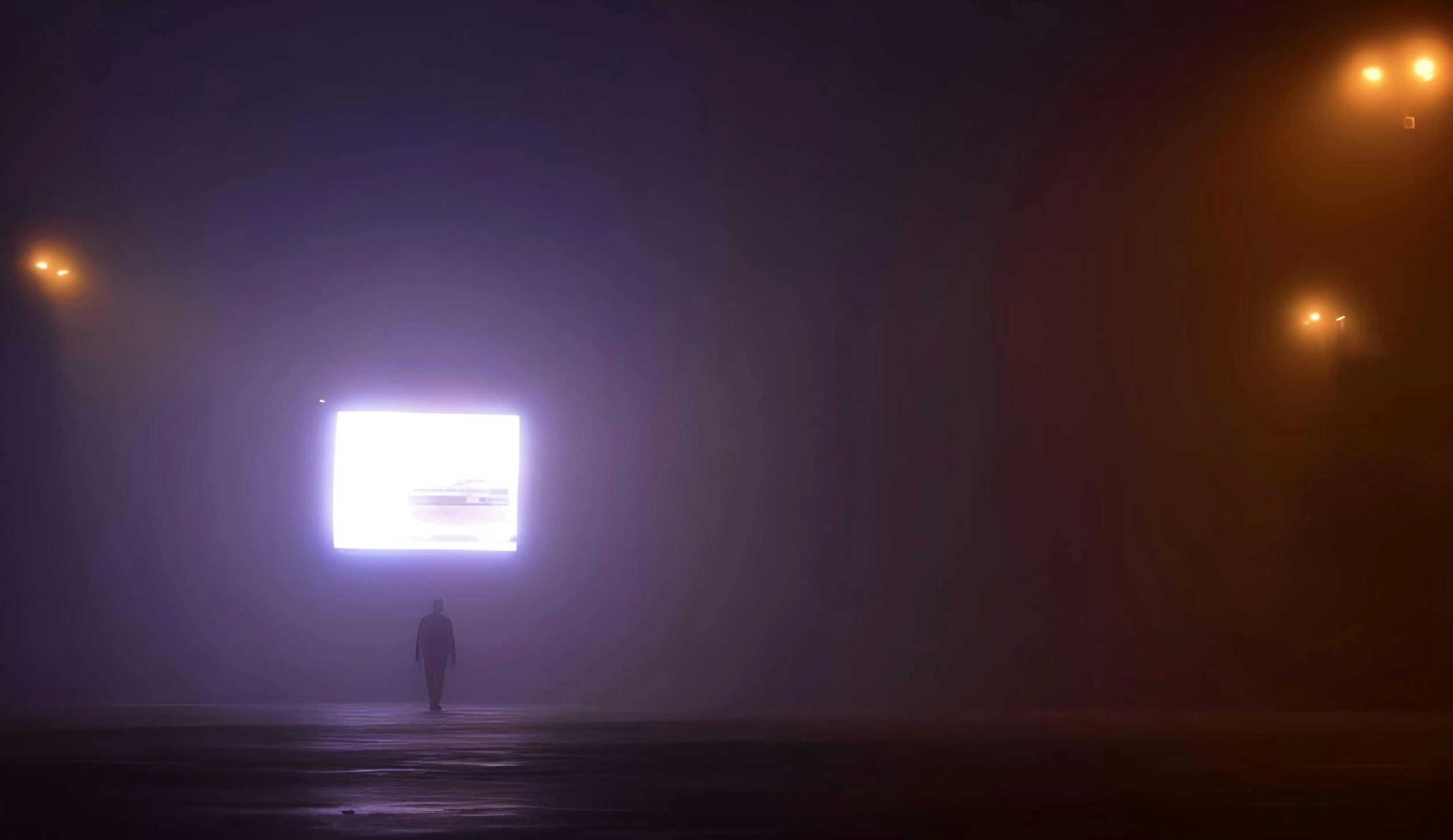 a man is standing in the middle of an empty road