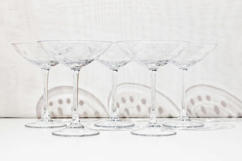 a group of six glasses are shown with different shapes