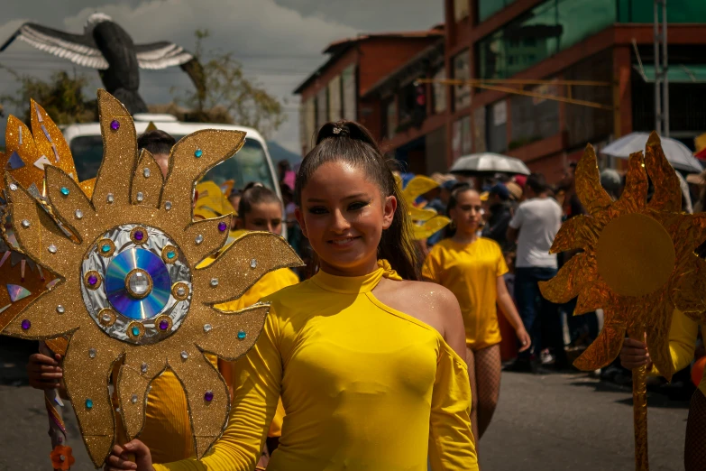 a group of women walking down the street in bright outfits