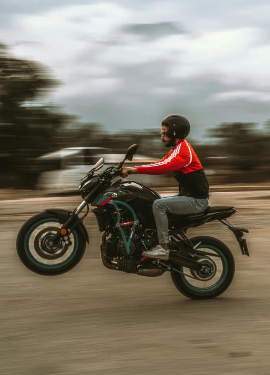 a man is riding a motorcycle on a street