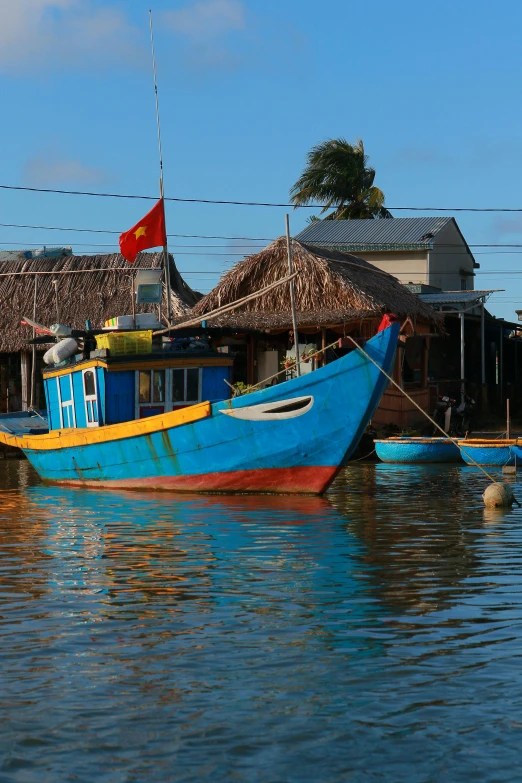 a few small boats are docked at a harbor