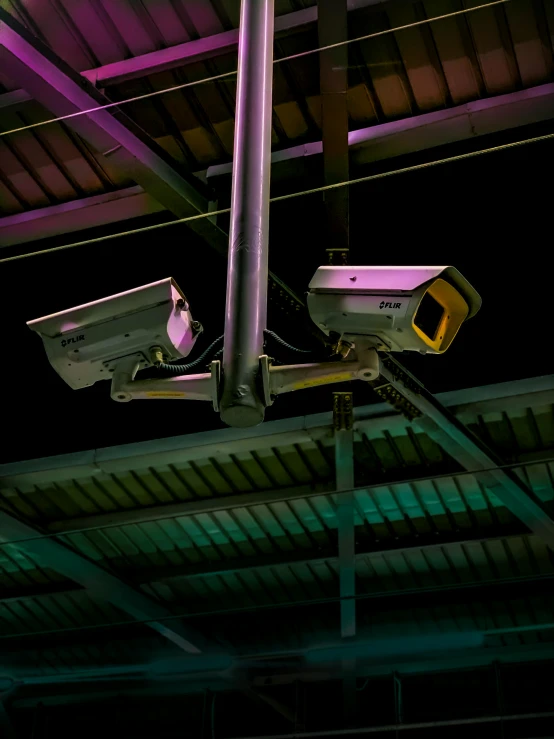 a surveillance camera attached to the side of a building